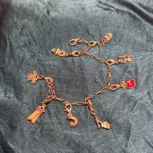 Silver tone charm bracelet. (Photo is wrong) cute!  Can change charms.